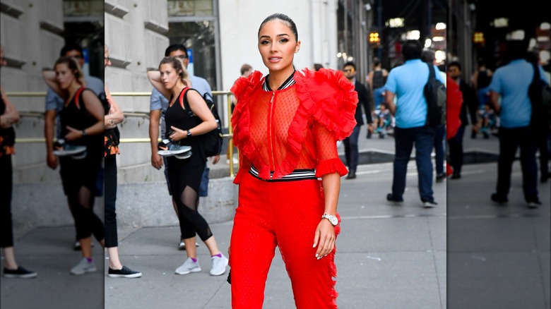 Olivia Culpo red see-through blouse