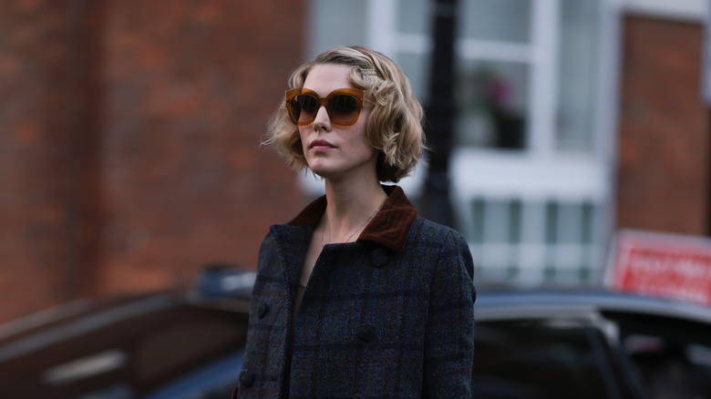 Woman with short black-to-blond ombré