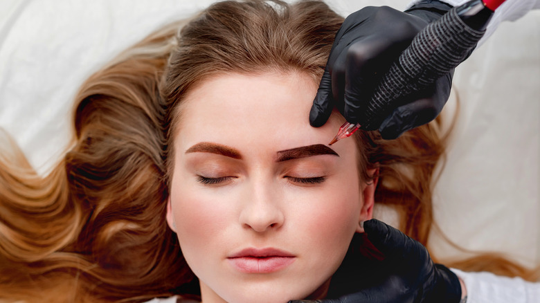 woman receiving a microblading procedure