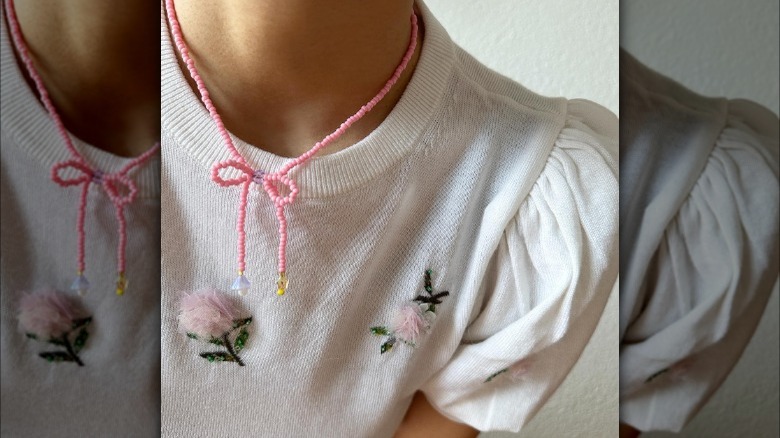Girl wearing beaded bow necklace