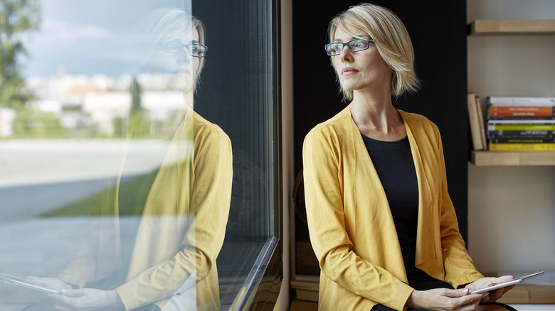 Woman looking out of window