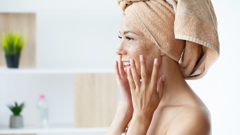 woman using a face scrub