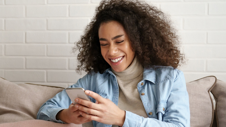 woman holding phone