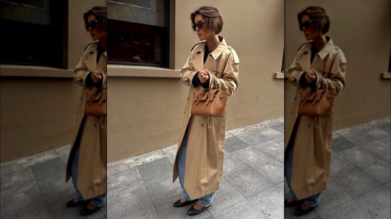 A woman in a trench coat