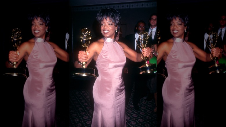 Oprah in gown holding awards
