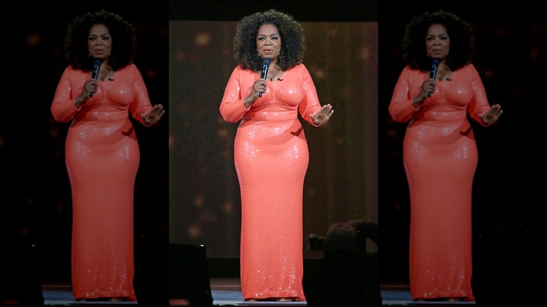 Oprah wearing coral dress