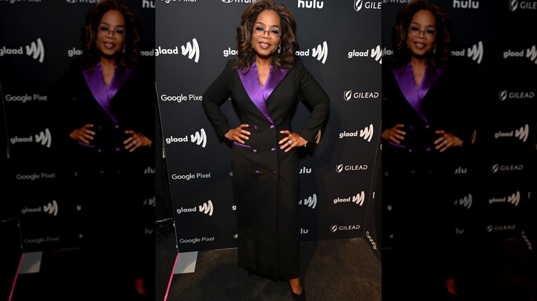 Oprah in black and purple suit