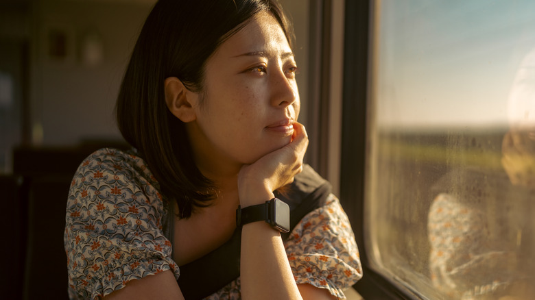 Woman thinking on train