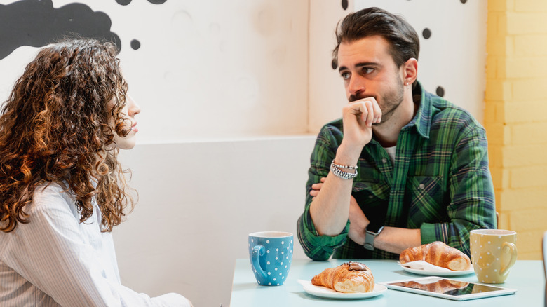 couple talking at cafe