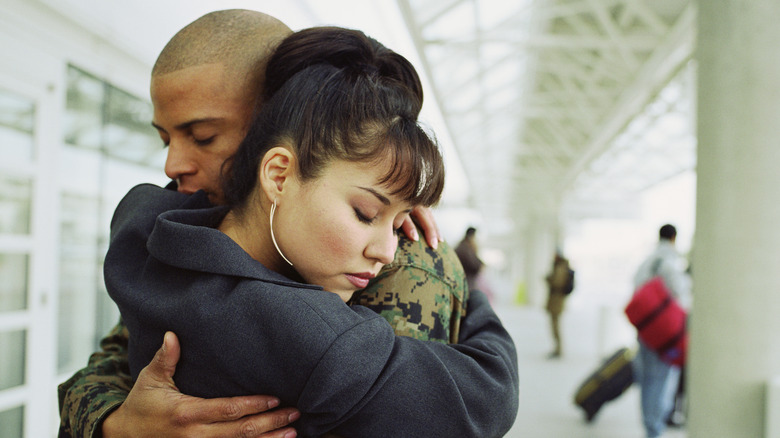 man and woman hugging