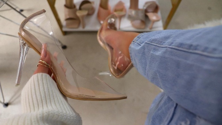 Woman wearing translucent heels