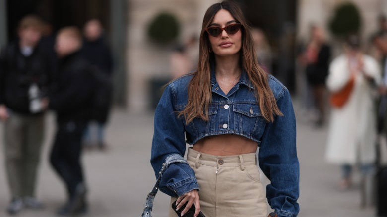 Woman in cropped denim jacket