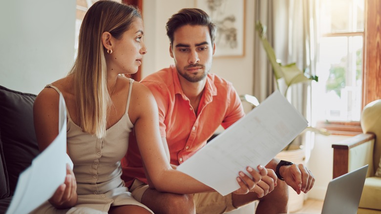 couple with papers