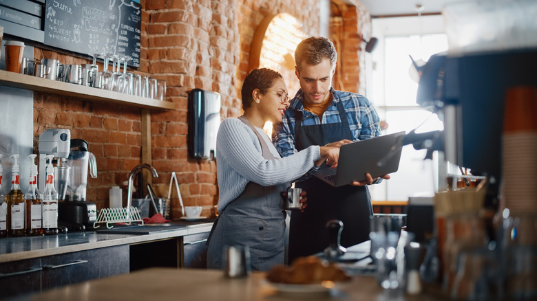 Two employees in coffee shop