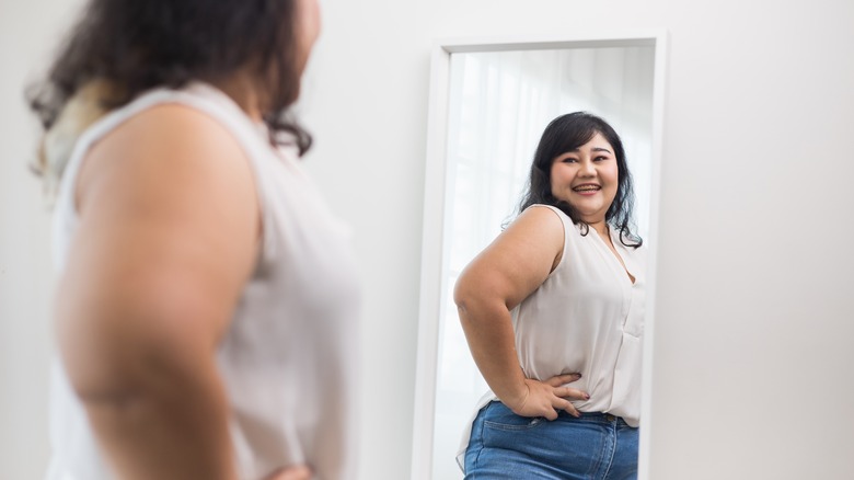 woman in mirror smiling