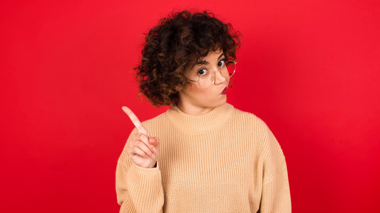 woman waving her index finger