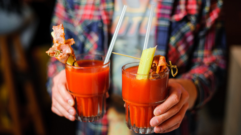 person holding bloody marys