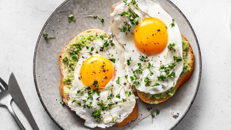 eggs and avocado toast on plate