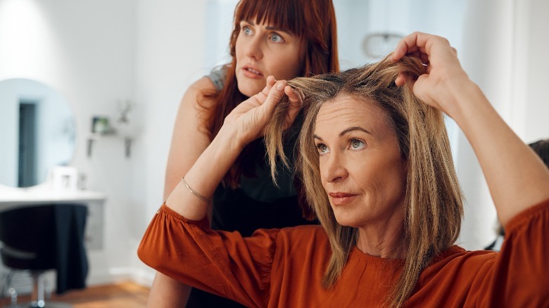 Woman speaking to hairstylist