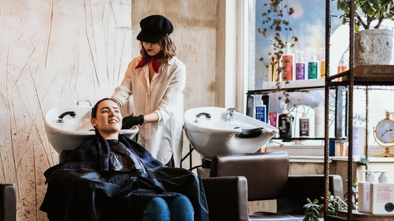 Woman getting hair washed