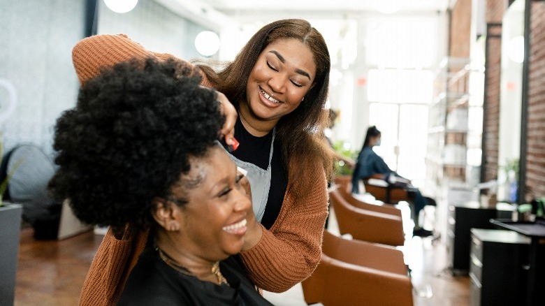 Woman getting her hair styled