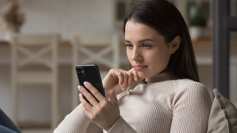 Woman reading on her phone