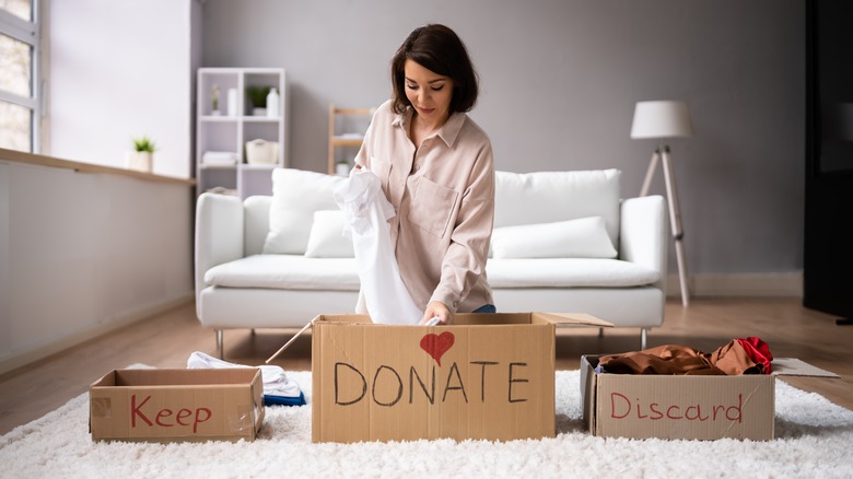 Woman sorting through clothes