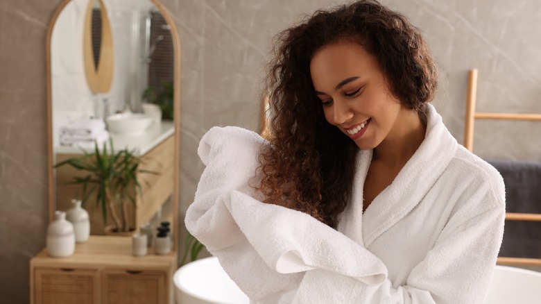Woman towel drying hair
