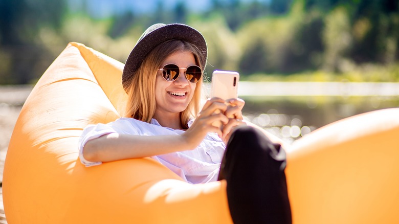 smiling woman on phone