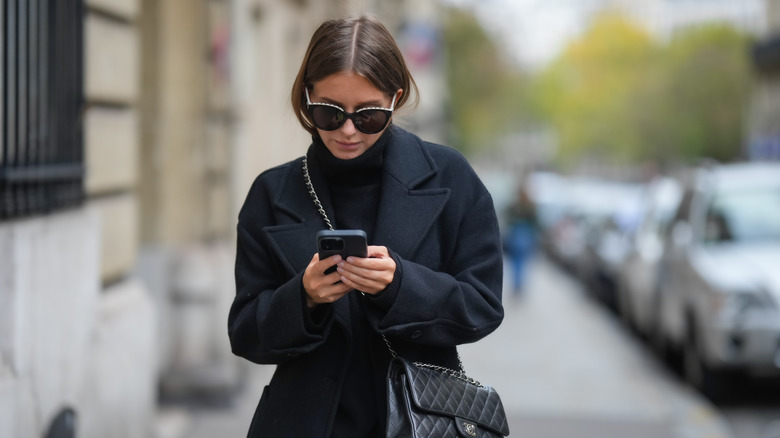 woman walking and texting