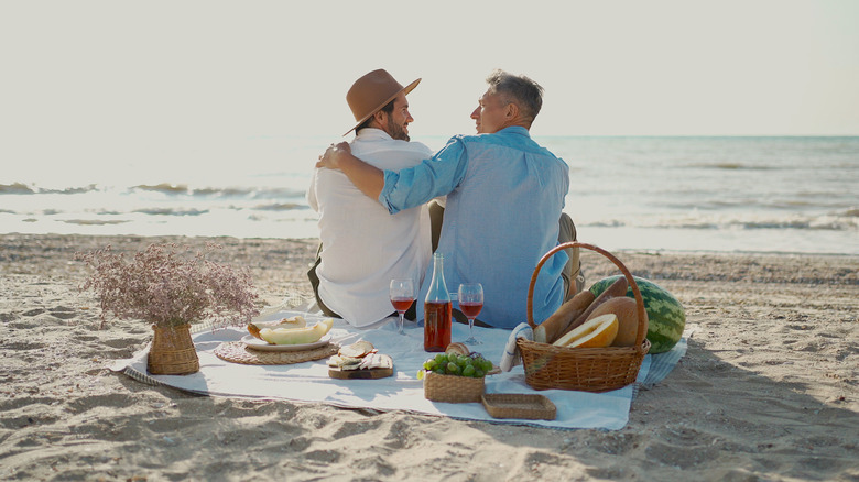 couple on a beach picnic 