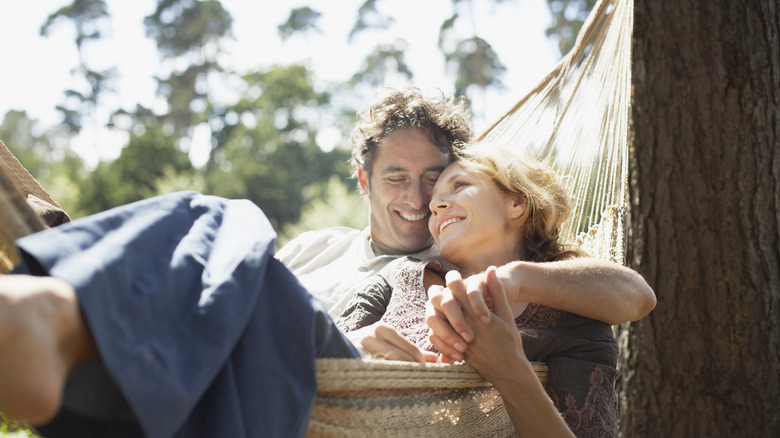 couple cuddling in hammock