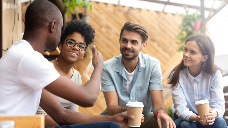 Four people having a conversation