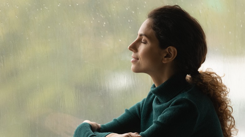 Woman listening to the rain