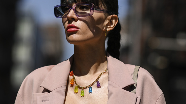 woman wearing gummy bear necklace