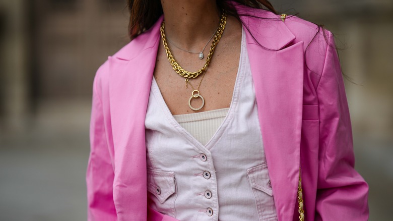 woman wearing chunky gold chain 