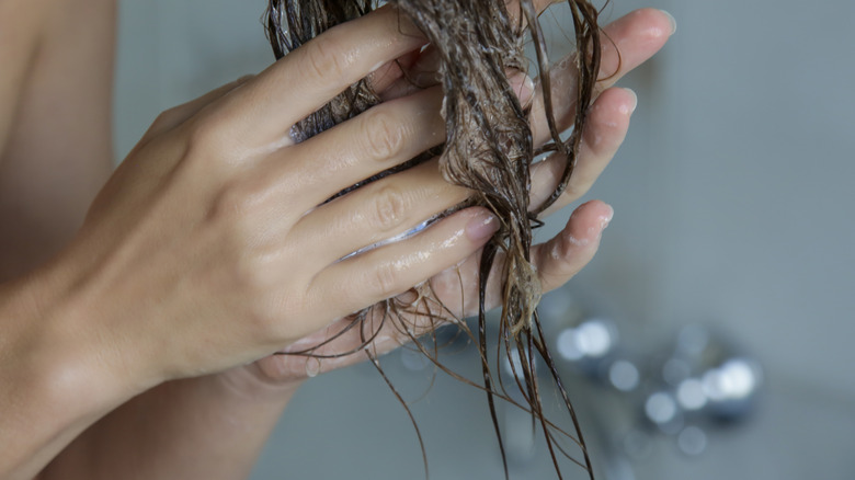 Person using hair treatment