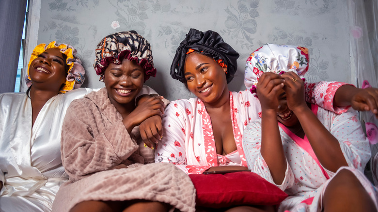 Women wearing satin bonnets