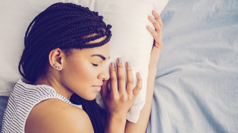 Woman wearing braids to sleep