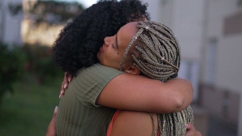 Two women hugging