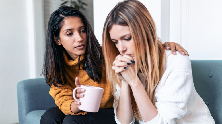 woman comforting friend