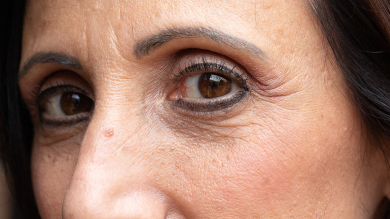 Older woman dark black eyeliner