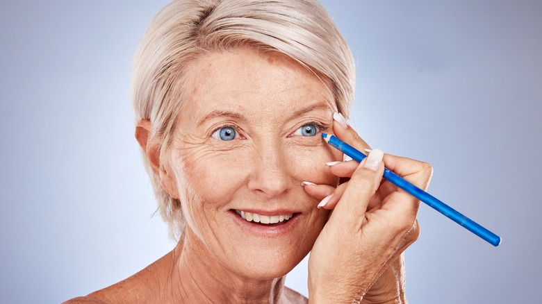 Mature woman blue eyeliner