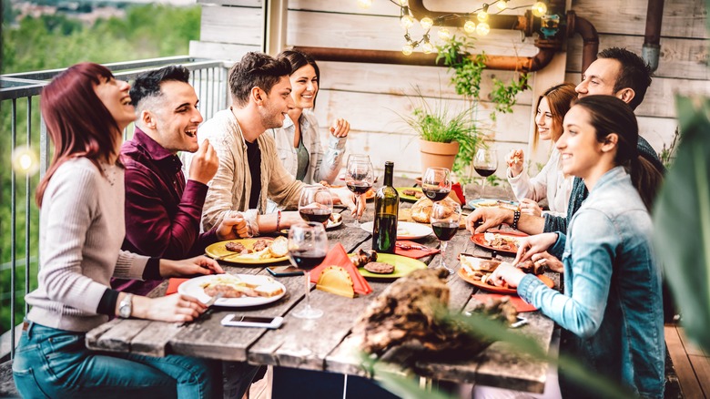 friends at table eating together