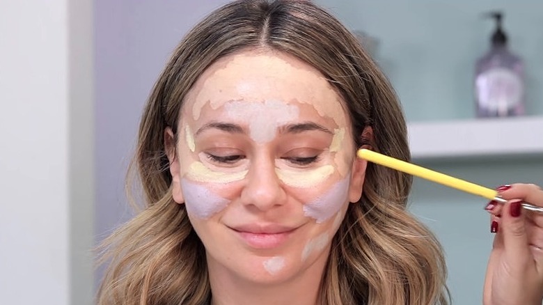 woman with color-correcting concealer