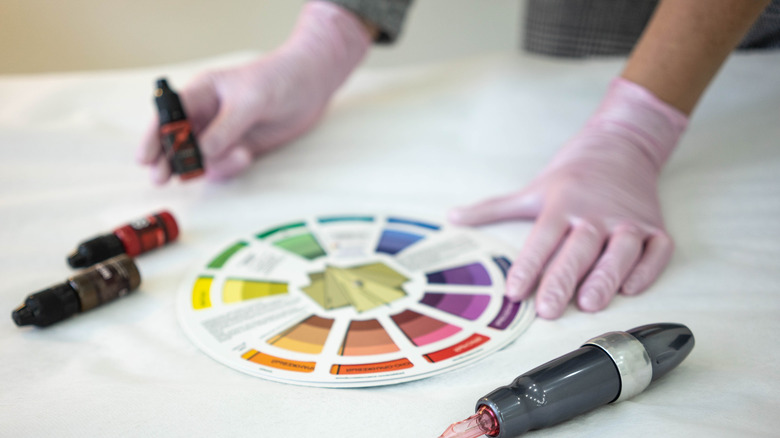 Person using the color wheel