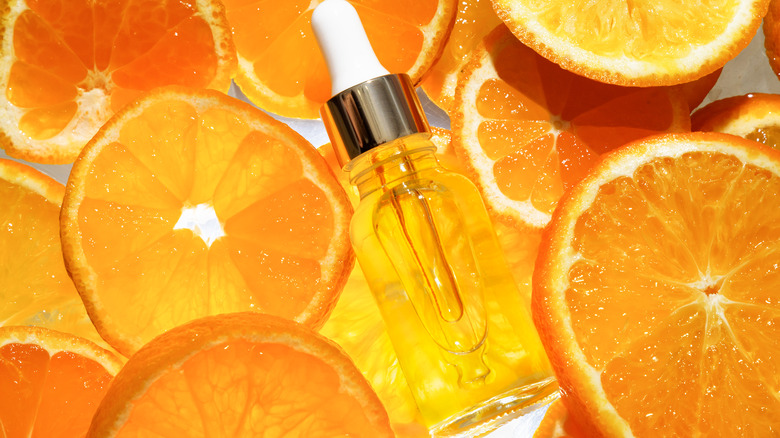 Vitamin C serum with sliced oranges