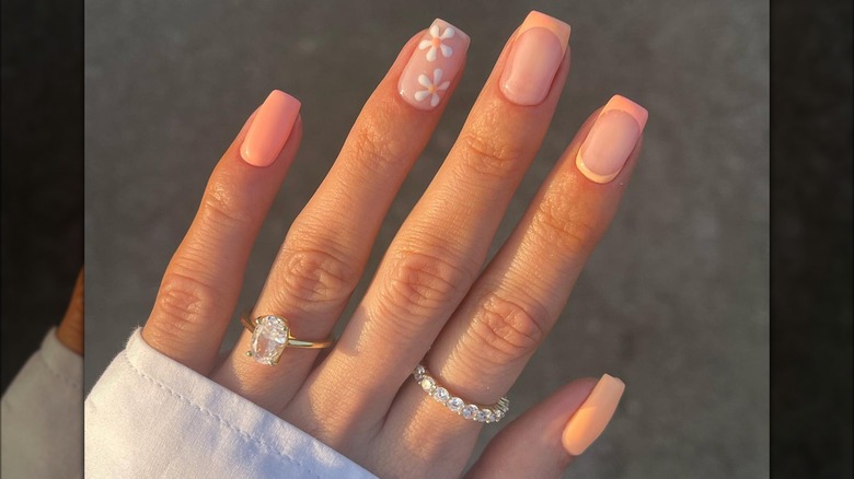 Peach manicure floral French tips
