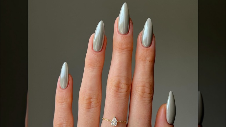 woman with silver milk nails