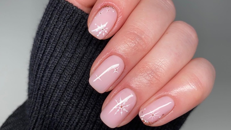 woman with snowflake nails
